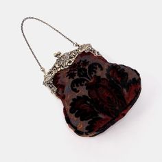 Introducing our captivating collection of Chatelaine purses, inspired by the elegance of the Victorian era.Available in three sizes—Large, Medium, and Small—these purses offer versatility and style. The Large and Medium sizes can be used as both a clutch and a crossbody purse, as we provide two chains for each size: 50" and 13" in length. This allows you to effortlessly switch between crossbody and clutch styles.Let's focus on the Chatelaine Large Crossbody Purse:With a frame width of 6.25" and a height of 8", this purse comfortably holds larger items like the iPhone 14 Pro Max and a passport. It features a small slip pocket for cards or small essentials, and the 1.5" bottom depth provides ample space for your necessities.The Large Crossbody Purse includes two chains, each with brass hooks Antique Satchel For Formal Occasions, Antique Formal Satchel Bag, Antique Style Formal Satchel Bag, Victorian Handmade Evening Bag For Formal Occasions, Elegant Brown Rectangular Coin Purse, Elegant Evening Bag For Vintage Events, Victorian Style Formal Rectangular Shoulder Bag, Formal Victorian Rectangular Shoulder Bag, Vintage Clutch With Removable Pouch For Formal Events