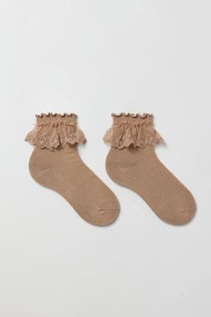 Soft ribbed knit crew socks trimmed with a ruffle accent. Content + Care 76% Cotton, 22% polyester, 2% spandex Machine wash Imported Size + Fit Crew length | Ruffle Ribbed Crew Sock in Taupe, Women's at Urban Outfitters Winter Ruffle Socks, Socks And Clogs, Fall Socks, Ruffle Socks, Ruffled Socks, Crew Sock, Winter Fits, Knitting Socks, Crew Socks