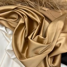 Gold satin silk fabric silk by the yard Gold satin fabric Pink Silk Satin fabric *Material: 20% silk, 75% polyester, and 5% elastane. *Width: 1.4 m = 55 in = 1.53 yards * Price for 1 meter/1.1 yards - 9.5$ *Soft Silk Satin Fabric of high quality can be used for dresses, skirts and bridal dresses. My clients are using this fabric for sewing for a long time and they are very satisfied with the quality. *Shipping company: USPS, DHL Express Worldwide. Please provide your phone number for a smooth an Solid Color Satin Silk Scarf, Party Silk Scarf With Satin Finish, Fabric Photography, Silk Satin Fabric, Gold Satin, Satin Silk, Fabric Silk, Pink Silk, Dhl Express