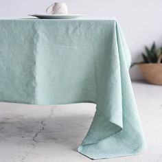 a table that has a green cloth on it