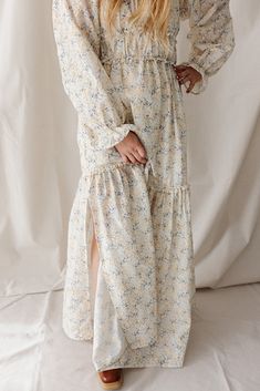 All sales are final for this item. There are no exchanges or returns. --- The Meadow Maxi Dress is made for marvelous moments. Crafted from 100% cotton with a delightful eyelet floral pattern, our Meadow maxi dress is fully lined with cotton voile for a breezy feel. Front bodice features a faux placket with two pearlized buttons, and an upside-down-v ruched waistband. The back bodice is smocked to hug the body comfortably-- making this a dream maternity and nursing-friendly dress! Long balloon s Spring Cotton Maxi Dress With Flowy Skirt, Spring Breezy Tiered Maxi Dress, Spring Cotton Floral Dress For Casual Wear, Modest Cotton Dress With Floral Print, Spring Floral Cotton Dress, Breezy Cotton Floral Print Dresses, Spring Maxi Dress With Ditsy Floral Print For Daywear, Feminine Cotton Maxi Dress With Floral Print, Spring Daywear Maxi Dress With Ditsy Floral Print