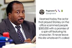 a man in a suit and tie sitting at a desk