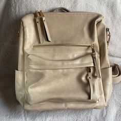 Cream Colored, Vegan Leather Backpack. Nwot. Removable Strap Included. Beige Backpack For On-the-go, Beige Rectangular Leather Backpack For On-the-go, Chic Faux Leather Everyday Backpack, Chic Everyday Faux Leather Backpack, Beige Backpack With Large Capacity For Everyday, Chic School Backpack With Zipper Pocket, Cream Satchel With Zipper For Travel, Cream Satchel With Zipper Closure For Travel, Rectangular Beige Backpack For Everyday Use