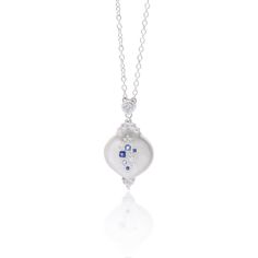 Evocative of falling raindrops, this pendant features a lovely array of blue sapphires and aquamarines with diamond accents. Set in sterling silver to accentuate the cool tones of the stones. Sterling Silver Blue Sapphire Aquamarine Diamond 16-18" Adjustable Sterling Silver Chain Satin Finish Style sc506-3 Luxury Sapphire And Diamond Necklace In Silver, Blue Diamond Briolette Necklace, Silver Sapphire Pendant Diamond Necklace, Luxury Sterling Silver Drop Diamond Necklace, Sterling Silver Briolette Diamond Necklace, Blue Diamond Pendant Necklace In Sterling Silver, Sterling Silver White Gold Drop Diamond Necklace, White Gold Drop Diamond Necklace In Sterling Silver, Silver Briolette Blue Topaz Jewelry