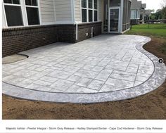 a brick patio being built in front of a house