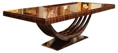 an art deco console table with marble top