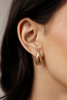 Elevate any outfit with these must-have Céline - gold teardrop stud earrings. As statement earrings, they provide an instant touch of sleek sophistication. These earrings are the perfect addition to any jewelry collection. MATERIAL: 18k PVD Gold plated Water resistant, tarnish resistant, hypoallergenic, & nickel/lead free. Classic Pear-shaped Gold Earrings, Classic Pear-shaped Polished Earrings, Minimalist Yellow Gold Teardrop Earrings, Tarnish Resistant, Minimalist Tarnish Resistant Teardrop Earrings In Yellow Gold, Minimalist Yellow Gold Teardrop Earrings, Modern Yellow Gold Teardrop Pierced Earrings, Modern Yellow Gold Pear-shaped Drop Earrings, Modern Yellow Gold Pear-shaped Drop, Modern Pear Shaped Drop For Formal Occasions