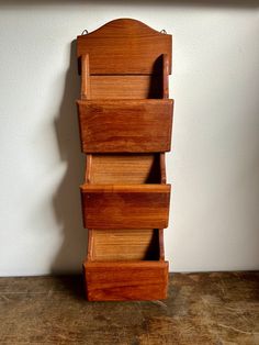 three wooden drawers stacked on top of each other