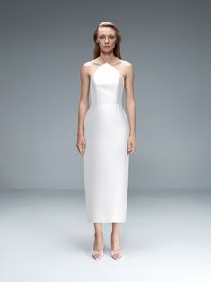 This "day to night" mini dress with triangular neckline marries modernism with elegance in the sleekest way. Style it with our Floral - Applique Gloves. White A-line Evening Dress, Classic H-line Wedding Dress, Formal H-line Midi Dress With Fitted Bodice, Satin Mini Dress With Straight Neckline For Wedding, Elegant A-line Mini Dress With Fitted Bodice, Fitted Bodice Evening Dress With Flattering Silhouette For Wedding, Sleek Wedding Slip Dress, Sleek Summer Dress With Sweetheart Neckline, Asymmetrical Neckline Evening Dress For Wedding With Fitted Bodice