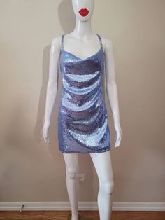 "Inspired by Dua Lipa's song \"Levitating\" It is made with a cornflower blue stretch sequin fabric. 100% lined 4 Rhinestone ornaments on the straps The skirt length from waist to hem is approximately 17\" and about 4\" above the knee (If you would like the skirt a little longer please contact me. Made to Order Sizes: Bust XS- 31-33\" Bust S- 34-36\" Bust M- 37-39\" Bust L- 40-41\" Bust Waist XS- 25-26\" waist S- 27-28\" waist M- 29-30\" waist L- 31-32\" waist Hips XS- 33-34 S- 35-36 M- 37-40 L- Dua Lipa Levitating, Bowie Ziggy Stardust, Rhinestone Ornaments, Multicolor Dress, Dua Lipa, Sequin Fabric, Women's Costumes, Inspired Dress, Cornflower Blue