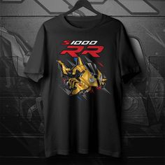 a black t - shirt with an image of a yellow and red robot on it