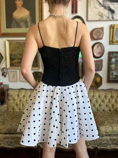 This 80s Vintage Polka Party Dress is perfect for any occasion. The size M features a smoked top and a flared polka bottom, giving it an eye-catching and unique look. Stylish and fashionable, you'll be sure to stand out in this dress. Size: Medium Chest: 32” Waist: 30” This is a preloved item. Fitted Full Skirt Mini Dress For Party, Fitted Full Skirt Mini Dress For Evening, Retro Fitted Mini Dress For Cocktails, Summer Full Skirt Dresses For Night Out, Summer Night Out Dresses With Full Skirt, Summer Night Out Full Skirt Dresses, Fitted Retro Mini Dress For Parties, Retro Polka Dot Dresses For Party, Retro Summer Party Dress