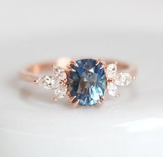 an oval blue and white diamond ring