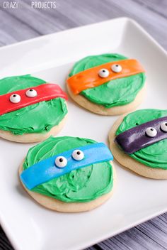 teenage mutant cookies decorated with green frosting and googly eyes