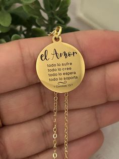 A beautiful gold disc necklace engraved in Spanish with "Love bears all things, beleives all things, hopes all things, endures all things, love never fails ", Necklace is 18" 18K Gold Plated Dainty chain. Great women's faith gift, Baptism, wedding, faith jewelry , 1 Corinthians 13:7. Charms are gold plated over stainless steel. Plated jewelry is a wonderful, affordable way to add a sophisticated look to your wardrobe, with the look of real gold. It is also an excellent choice for people with sen Gold Round Charm Necklace For Best Friend, Gold Round Charm Necklaces For Best Friend Gift, Inspirational Gold Necklaces For Valentine's Day, Inspirational Gold Necklace For Valentine's Day, Inspirational Gold Charm Necklaces For Mother's Day, Inspirational Gold Charm Necklace For Mother's Day, Inspirational Nickel-free Gold Necklace, Inspirational Gold Necklace For Personalized Gift, Inspirational Gold Round Pendant Jewelry