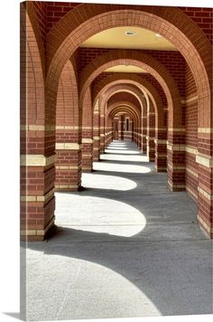 an arched walkway lined with brick arches