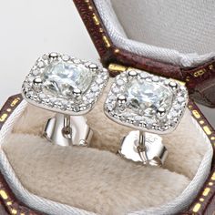 Earrings Information 
  


Metal: 
925 Sterling Silver 


Sku: 
EMO-023


Rhodium: 
Yes 


Nickle Free: 
Yes 


Gem Type: 
Moissanite


Stone Color: 
White


Center Stone Cut: 
Cushion Cut


Center Stone Weight: 
1.0ct*2pcs (6x6mm*2pcs)


Stone Setting: 
Prong Setting


Average Clarity: 
FL-IF 


Average Color: 
D-E 









LOOKS THE SAME AS DIAMOND (WITH NAKED EYES)
While diamonds are graded on the 4 C’s scale (Cut, Clarity, Color, Carat), AINUOSHI Moissanite® are not diamond, and are graded Silver Cushions, Halo Stud Earrings, Cushion Cut Moissanite, Luxury Earrings, Halo Earrings Studs, Moissanite Earrings, Stone Setting, Sterling Silver Studs, Sterling Silver Earrings Studs