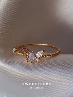 Product Details + Care - 18K Gold Dipped Over Brass - Brass: Copper + Zinc Alloy - 1 Ring - Wipe Clean - Imported Dimensions - Size is 6 Have a question? Please message info@shopsweetpeeps.com and our support team will get back to you in 48 hours. Butterfly Gold Ring, Blue Butterfly Ring, Cute Promise Rings, Ring Aesthetic, Gift Wishlist, Dainty Rings, Cute Engagement Rings, Clothing Art, Dainty Gold Necklace