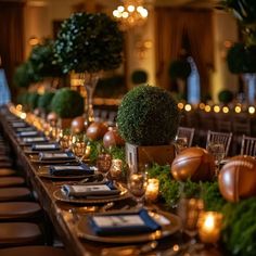 a long table is set with place settings, candles and centerpieces for an elegant event