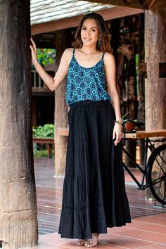 Part of Ying and Joy's signature cotton double gauze collection this black tiered maxi skirt is an essential foundation item for your wardrobe. The elastic waist is accompanied by horizontal rows of shirring elastic adding shape comfort and versatility. This travel friendly skirt has two side seam pockets and teams back perfectly with the design duo's extensive collection. Black Cotton Maxi Skirt For Summer, Summer Black Cotton Maxi Skirt, Casual Black Tiered Maxi Skirt, Black Tiered Maxi Skirt For Summer, Black Tiered Bottoms With Elastic Waistband, Casual Black Tiered Bottoms, Black Tiered Maxi Skirt Outfit, Black Tiered Skirt Outfit, Tiered Maxi Skirt Outfit