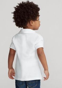 Made from easy-to-care-for cotton mesh and finished with Ralph Lauren Childrenswear's signature embroidered pony, this Polo shirt is a preppy staple you'll both love. | Ralph Lauren Childrenswear Boys 2-7 Cotton Mesh Polo Shirt, White, 2T Preppy Cotton Polo Shirt For Spring, Preppy Cotton Collared Tops, Preppy Collared Cotton Tops, Preppy Fitted Top With Polo Collar, Summer Cotton Polo Shirt For School, Summer School Cotton Polo Shirt, Fitted Cotton Preppy Tops, Fitted Preppy Cotton Tops, Preppy Fitted Cotton Tops