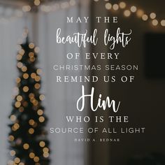 a christmas tree with lights in the background and a quote on it that says, may the beautiful light of every christmas season remind us of him who is the source of all