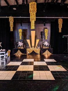 a black and white checkered floor with chandeliers