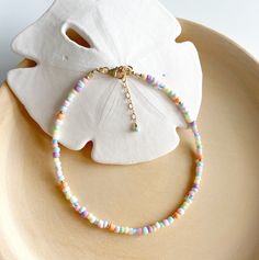 The Boa Vista anklet combines pastel coloured glass and gold beads to evoke that relaxed summer beach vibe! The Cape Verde Island of Boa Vista has some of the most beautiful stretches of beach that you'll find and it inspired the pastel ice cream colours of this ankle bracelet. Measures 9in and extends to 10in. Delivered in our pretty gift box, so fantastic as a present for a friend or to yourself! Matching bracelet https://www.etsy.com/uk/listing/1487665495/boa-vista-multi-coloured-beaded-bracelet Matching necklace https://www.etsy.com/uk/listing/1473482162/pastel-beaded-necklace-colourful-gold Shipping Uk: 2-3 days - Royal Mail 48hr tracked International standard delivery: 6- 14 days (delays can occur especially in busy periods) Please be aware that standard shipping is UNTRACKED and doe Multicolor Tiny Beads Bracelet For Beach Season, Multicolor Tiny Beads Bracelets For Beach Season, Beaded Anklets For Beach Season, Multicolor Beaded Bracelets For Beach Season, Beaded Anklet Bracelet For Summer, Gold Beaded Bracelets For Beach Season, Bohemian Beaded Anklets For Beach, Gold Beaded Bracelets For Summer, Summer Gold Friendship Bracelets With Colorful Beads