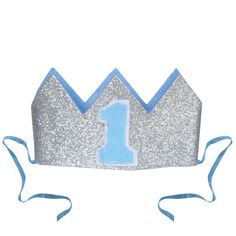 a blue and silver crown with the number one on it