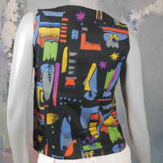 This European vintage multicolor vest has an abstract geometric pattern in blue, orange, green, purple, yellow, and gray on a black background. The cotton waistcoat closes in front with three yellow smiley face buttons, and features figure-enhancing contouring seams on the front and the back. Bust = 34 inches (86.36cm) Waist = Up to 33 inches (83.82cm) Vest Length = 21.5 inches (54.61cm) Size: 6 US, 10 UK Material: Cotton Sourced in Stockholm, Sweden Condition: Excellent (clean, soft, and supple Yellow Waistcoat, Orange Green Purple, Yellow Smiley Face, 1970s Fashion, Stockholm Sweden, 1960s Fashion, European Vintage, Plaid Blazer, Vintage Summer