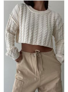 The coziest Cable Knit Cropped Sweater in Cream will be your go to seasonal top. DETAILS Cropped Thick cable knit Cream color 100% COTTON Et Clet is a women's contemporary clothing brand that offers timeless yet modern styles for the fashion-forward woman. With its focus on effortless style and timeless design, Et Clet is a go-to brand for the modern woman who wants to elevate her wardrobe. Cable Knit Cropped Sweater, Cable Knit Sweater For Loungewear, Cotton Cable Knit Sweater For Loungewear, Cozy Cable Knit Tops For Loungewear, Cream Cable Knit Tops For Fall, Chunky Knit Cotton Cropped Sweater, Fitted Cable Knit Cozy Top, Fitted Cozy Cable Knit Top, Cozy Fitted Cable Knit Top