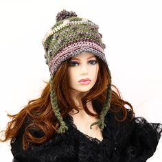 Comfortable and fun to wear, this soft funky and bumpy Fae snow hat has braids for ties. The top has a matching pom pom and the body has textural bumps worked in, giving a rustic feel to your look. You can roll back the brim to give a different look, or leave a bit of a brim. I've shaped it to sit secure on your head and cover your ears so you can wear it untied, but the braids are still long enough to tie if you want to. Great for skiing, sledding, going to an outdoor market, running your erran Casual Brimmed Mini Hat For Winter, Casual Winter Brimmed Mini Hats, Adjustable Fall Hat With Ear Flaps, Adjustable Ear Flap Hat For Fall, Warm Adjustable Beanie One Size, Adjustable Ear Flaps Hat For Fall, Adjustable Cap For Cold Weather, Casual Adjustable Mini Hats For Winter, Casual Winter Bucket Hat