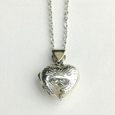 Pretty, Engraved Sterling Silver Heart Shaped Locket. Opens To Accomodate Two Small Pictures, Or A Tiny Token. Stamped 925 Inside. Comes On A Chain Of 18". New, Comes In Gift Box Ready For Gift Giving. Price Firm, Thank You. Bam-Lock64 Nickel-free Heart Locket Necklace For Anniversary, Nickel Free Heart-shaped Necklace For Wedding, Nickel-free Heart Necklace For Anniversary, Cresent Moon Necklace, Earthy Necklace, Silver Heart Locket, Heart Shaped Locket, Long Stone Necklace, White Beaded Necklaces