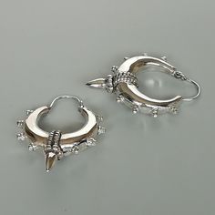 A PAIR of chunky ethnic style sterling silver spike hoops. Dimensions: Length (with spike) 33mm Width: (with spike) 25 mm Weight: 10.8 gm Price listed is for a PAIR of hoops. These earrings are made of 925 hypoallergenic sterling silver Can be packaged in a gift box. I can include a personal message from you if needed You are welcome to contact me at... bhavnakwintra1956@gmail.com For more beautiful pieces from my shop, please browse 👇 TOE RINGS: https://www.etsy.com/your/shops/TheSilverGame/to Hoop Earrings Chunky, Egyptian Jewelry, Ethnic Style, Sterling Silver Hoops, Toe Rings, Silver Hoops, Personal Message, Bali, Silver Rings