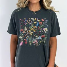 "floral shirt,wildflowers shirt,pressed flowers boho shirt,flower shirt,botanical shirt,gardening tee,cottagecore shirt, cottagecore flowers, Vintage Wildflowers,vintage floral shirt,Wild Flowers Shirt This nature design on an oversized t shirt will be a favourite for nature lovers and wildlife enthusiasts. Camping tshirt, hiking shirt. WILDFLOWERS TSHIRT, Cottagecore Shirt, Bug tshirt, Insect Shirt, Cottage tshirt, Cottagecore Shirt, Cottage Core Shirt *Comfort color garment dyed shirts are super popular right now and these cotton washed tees are the nicest, softest shirts to wear. The colors are true, amazing and gorgeous and will never pile. The double-needle stitching throughout the tee makes it highly durable while the lack of side-seams helps the shirt retain its tubular shape.  Shir Short Sleeve Ditsy Floral Tops For Garden Party, Ditsy Floral Print Short Sleeve Tops For Garden Party, Summer Floral Patchwork Short Sleeve Tops, Floral Patchwork Short Sleeve Summer Tops, Floral Patchwork Short Sleeve Tops For Summer, Short Sleeve Tops With Floral Patchwork For Summer, Casual Short Sleeve Top With Floral Patchwork, Floral Print Short Sleeve Tops For Garden Party, Bohemian Floral Print Tops For Garden Party