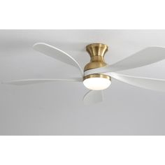 a white ceiling fan with a light on it's blades and a gold finish