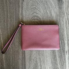 Brand New, Never Used, Pink Coach Wristlet. Care Instructions Card Included. Inside Is Made Up A Maroon Material, With Gold Hardware. Strap Wrist Is Not Detachable! Coach Emblem Is Written In Hold As Well! Coach Wristlet With Zipper Pouch For Daily Use, Coach Wristlet Pouch For Daily Use, Daily Use Coach Wristlet Pouch, Daily Use Coach Pouch Wristlet, Coach Rectangular Wristlet With Zipper Pouch, Coach Zipper Pouch Wristlet, Coach Wristlet With Zipper Pouch, Coach Zipper Wristlet, Coach Wristlet With Removable Pouch For Daily Use