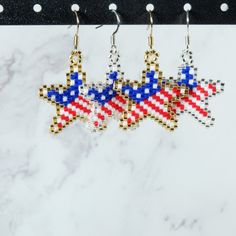 Cute star-shaped earrings with an American Flag pattern! Perfect for celebrating the 4th of July, Memorial Day, President's Day, or to just be patriotic! They are about the size of a quarter but are very lightweight. They come standard with ear hooks, but can be made with a clip-on style upon request at no additional charge. This pair of earrings is made-to-order. Please allow 3-5 business days for processing. Patriotic Earrings For 4th Of July, Independence Day Dangle Earrings As Gift, Independence Day Dangle Earrings Gift, Patriotic Earrings For 4th Of July Gift, 4th Of July Beaded Earrings, Patriotic 4th Of July Earrings, Patriotic American Flag Jewelry For 4th Of July, Independence Day Gift Dangle Earrings, Patriotic Drop Earrings For 4th Of July