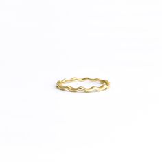 Add the perfect amount of texture and intrigue to your ring stack with The Scallop Ring. It's also the sweetest dainty ring all on it's own. Representing the highs and lows of life and the waves of the ocean coming to shore, this ring is sure to capture your imagination. Solid yellow gold in your choice of 10k, 14, or 18k. Ring width is approximately 2.05mm and fits true to size. Gram weight will vary based on metal karat and size. Every package is insured and will require a signature upon deliv Waves Of The Ocean, Ring Stack, Dainty Ring, Solid Yellow, Stacking Rings, The Ocean, Ring Earrings, High & Low, Ring Size