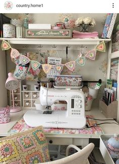 a sewing machine sitting on top of a table next to a shelf filled with books