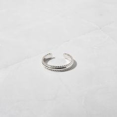 Toe rings are a must have in the spring/summer months! They add such a nice touch to your look. Great for sandals, flip flops & beach days! This toe ring features an adjustable design with a spiral border design for a dainty touch! Made of 925 Sterling Silver THICK plating of 14k Gold or Rhodium VERY HIGH QUALITY Nickel-free & Hypoallergenic 🎁 Comes in a gift-box, ready for gift giving!✈️ Ships same day for fast delivery!♡ Made with 100% Pure Love! Summer Beach Midi Rings, Trendy Adjustable Rings For Spring, Trendy Adjustable Spring Rings, Trendy Adjustable Midi Rings For Summer, Adjustable Midi Rings For Summer, Elegant Rings For Summer Beach Occasions, Elegant Summer Beach Rings, Trendy Adjustable Rings For Summer, Adjustable Midi Rings For Beach