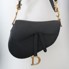 Authentic Classic Black Dior Saddle Bag. Authenticity Card Included. Absolutely No Wear And Tear. Bag Is In New Condition. Has Never Been Worn, Has Never Held Any Contents. Luxury Saddle Bag With Detachable Strap, Luxury Saddle Bag With Gold-tone Hardware, Luxury Black Saddle Bag With Branded Hardware, Designer Evening Saddle Bag, Designer Saddle Bag With Branded Hardware For Formal Events, Luxury Black Saddle Bag With Detachable Strap, Luxury Black Saddle Bag With Detachable Handle, Black Luxury Saddle Bag With Detachable Strap, Luxury Black Saddle Bag For Evening