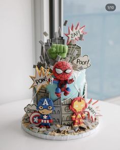 a birthday cake decorated with cartoon characters on it