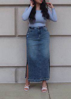 PRODUCT DETAILS: Medium wash denim maxi skirt Comfort Stretch Double side slit 5 pockets Functional buttons and zipper Raw hem True to size Length: Slit length: Model is wearing a size Large Model Info: Height: 5'6", Bust: 41", Waist: 34, Hips: 41" 98% Cotton, 2% Spandex Skirts With Slits On Both Sides, Istanbul Outfits, Upcycled Denim Skirt, Long Denim Skirt Outfit, Jeans Long Skirt, Classy Short Dresses, Jean Skirt Outfits, Elegant Wear, Trendy Outfit Ideas