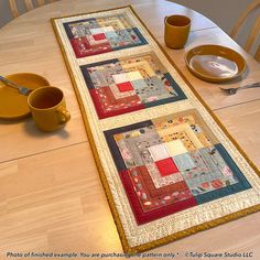 the table runner is made up of quilts and placemats on top of each other