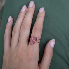 Delicate oval Rhodonite ring with tiny Rhodonite stone pieces captured in glass like resin in three crystal sizes. Bright ring is a perfect compliment to your everyday style. Beautiful by itself or in a stack. Every piece is hand made in our studio and always unique. Metal: 14k gold filled or Sterling Silver. Style: Oval 6x4mm crystal on a 1mm thick band. Size: Available in many sizes ready to ship. If you would like your ring made in a custom size feel free to reach out. Rhodonite Ring, Sparkle Jewelry, Ring Sale, Ying Yang, Delicate Rings, Bracelet Collection, Crystal Rings, Everyday Style, Unique Rings