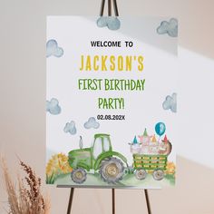 a welcome sign with a tractor and farm animals on it for a baby's first birthday party