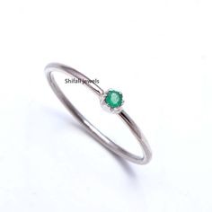 "RING DETAIL Metal : 925 sterling silver Center stone : Natural Colambian Emerald Size of stone : 3mm Shape : Round About gems stone Emerald Emerald is a valuable gemstone that is likewise referred to by different names, for example, \"Panna\", \" Zamarrud\", \"Maragdam\", and \"Greenstone\" The tone changes from green to greenish-blue. It has a place with the mineral Beryl, the green is brought about by the presence of chromium, vanadium or iron (or any blend of those three components) and inco Green Sterling Silver Stackable Promise Rings, Everyday Minimalist Emerald Ring, Green Minimalist Stackable Rings With Bezel Setting, Minimalist Green Stackable Rings With Bezel Setting, Green Minimalist Open Stackable Rings, Green Minimalist Stackable Open Rings, Minimalist Green Stackable Open Rings, Green Emerald Stackable Rings In Minimalist Style, Silver Minimalist Emerald Gemstone Ring