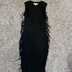 Soft Material Never Worn Chic Fringed Maxi Dress For Night Out, Chic Fringe Maxi Dress For Night Out, Fitted Maxi Dress With Fringe For Night Out, Black Fringe Maxi Dress For Evening, Chic Black Tassel Dress, Sleeveless Fringe Maxi Dress For Night Out, Black Maxi Dress With Tassels, Black Maxi Dress With Fringe For Spring, Spring Black Maxi Dress With Fringe