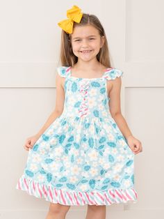 This Teal Daisies & Candy Stripes Ruffle Dress will have your little fashionista blooming with joy! Featuring a playful mix of florals and candy stripes, this sister set puts the fun in functional. With its ruffle detailing and trendy teal color, your little one will be the talk of the playground. Fits true to size. 95% Polyester / 5% Spandex Accessories sold separately. Suggest bow color #55 and #64 Import. Lydia is 49 inches tall and 61 lbs wearing size 3XL (7 YRS). **Afterpay and Sezzle Purchase Requires $35 Minimum Order. Candy Stripes, The Talk, Teal Color, Teal Colors, Ruffle Dress, Little One, Daisy, Stripes, Candy